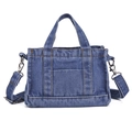 Blue denim tote bag with contrast stitching and detachable shoulder strap in a clean studio view - Blue