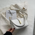 Chic white leather shoulder bag with gold metal clasp and adjustable strap for women - Off White