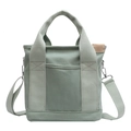 Minimalist light green canvas tote bag with adjustable shoulder strap and front pocket - Green