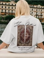Detailed back view of white cotton oversize t-shirt featuring colorful vintage carpet print - S / White