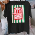 Women's black cotton T-shirt featuring a vintage sardine tin art print in bedroom setting - Black