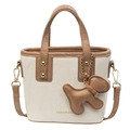 Mini cream bucket bag with brown handles and a cute dog charm in a minimalist style - With Pendant / Off-white