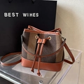 Chic woven brown and black bucket bag with leather base and adjustable strap - Chocolate