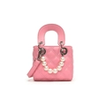Pink quilted leather bucket bag featuring a large pearl handle and crossbody strap - Rose Red