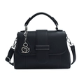 Black pebbled leather handbag with swan pendant and adjustable shoulder strap - Black