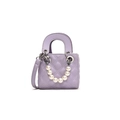 Quilted lavender mini bucket bag with pearl handle and silver hardware detailing - Purple