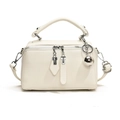 Chic cream-white Boston crossbody bag in lychee texture leather with silver ball charm - White