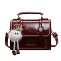 Vintage burgundy leather handbag with gold rivets and cute plush doll charm - Burgundy