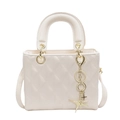 Elegant cream white quilted crossbody bag with golden star pendant and round handle - Off White