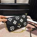 Black pebbled leather crossbody bag with white clover print and gold chain strap - Black