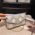 Taupe textured crossbody bag with beige clover pattern and gold chain strap - Gray