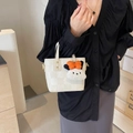 Petit sac seau blanc à motif trèfle texturé et breloque peluche à nœud orange - Sans Pendentif / Blanc