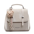 Mini cream PU leather backpack with decorative metal buckles and a brown plush bear charm - With Pendant / Off White