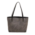 Vintage gray textured tote bag with black leather trim and metal rivets in a 2025 spring style - Black