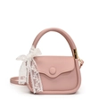 Pink lychee leather mini tote bag with a white lace bow and matching crossbody strap - Pink
