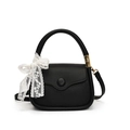 Elegant black textured leather crossbody bag with a white lace bow and gold hardware - Black