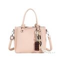 Pink lychee leather bucket bag with knot handle, chain, and chocolate charm accessory - Lotus root pink