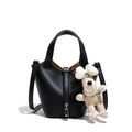 Black lychee leather bucket bag with silver lock and plush dog charm, long strap - Black