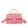 Pink lychee textured leather mini handbag with gold metal hardware and fashion text - Pink