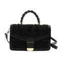 Minimalist black embroidered handbag with gold hardware and twisted leather handle - Black
