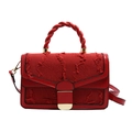 Red tweed shoulder bag with elegant knot handle and gold hardware in minimalist style - Red