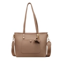 Brown textured leather tote bag with tassel charm and wide woven crossbody strap - Khaki