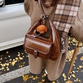 Retro brown oil wax leather shoulder bag with plush charm and contrast stitching details - Coffee with Pendant