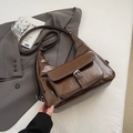 Caramel brown oil wax leather shoulder bag with white contrast stitching and front pocket - Brown