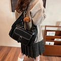 Chic black oil wax leather shoulder bag with white contrast stitching and poodle charm - Black With Rabbit Pendant