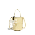 Light yellow textured bucket bag with decorative white flower and detachable strap - Yellow