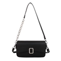 Black pebble leather crossbody bag with silver hardware and chain strap on white background - Black