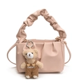Pleated dumpling bag in nude pink matte faux leather with a cute teddy bear charm - Pink