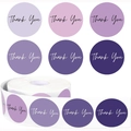 Macro detail of round purple gradient thank you stickers in a 500-label roll format - Purple Gradient (GG26)