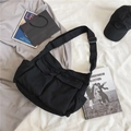Borsa a tracolla in tela nera con tasche multiple in stile minimalista unisex - Nero