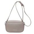 Minimalist beige pebble leather crossbody pillow bag with silver branding and strap - Apricot