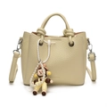 Beige lychee pattern bucket bag with FASHION lettering and cute cartoon charm - Off-white