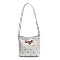 Polka dot shoulder bag with red bow pattern and metallic heart charm detail - Blue