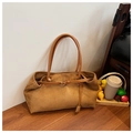 Minimalist brown matte leather tote bag featuring a decorative gold buckle and long handles - Brown