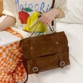 Vintage brown messenger backpack with top handle and dual buckle straps in matte finish - Brown