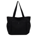 Black canvas tote bag for women featuring front metal snap pocket and elastic side pockets - Black