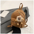 Schicker brauner Wildleder-Minirucksack mit goldenen Zippern und Plüsch-Löwenanhänger - Mit Anhänger / Braun