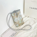 Crossbody phone bag in light blue featuring traditional Chinese embroidery and slim rope strap - White Buckle Blue