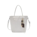 White woven bucket tote bag with chocolate charm and chunky black and yellow chain - White