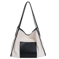 Detail of canvas tote bag with black leather pocket and fine texture stitching - Black