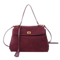 Macro shot of burgundy frosted leather handbag featuring a gold square twist lock closure - Red