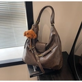 Dark brown leather tote bag with long straps and a plush teddy bear pendant - With Pendant / Coffee