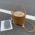 Brown woven bucket bag with drawstring closure, top handle and leather shoulder strap - Khaki