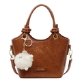 Brown bucket bag in glossy oil wax leather with decorative knot and plush charm - Brown