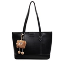 Black leather tote bag with white stitching and a brown furry monster charm pendant - Black