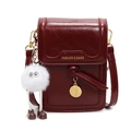 Deep red patent leather crossbody bag with gold round tag and plush mascot charm - With Pendant / Burgundy